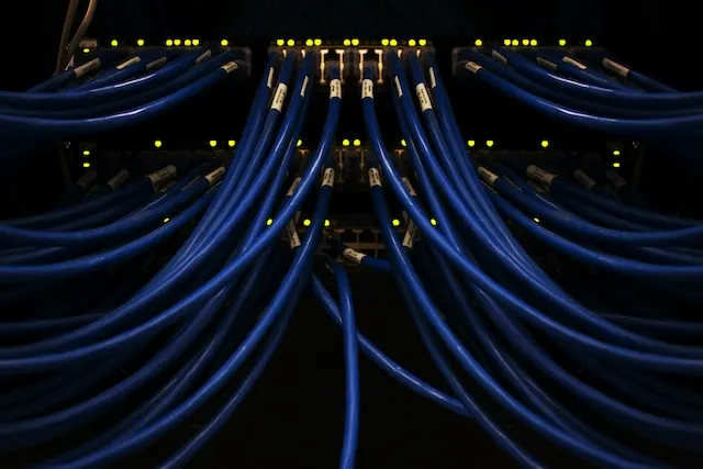 a rack of servers with wires and wires attached to them